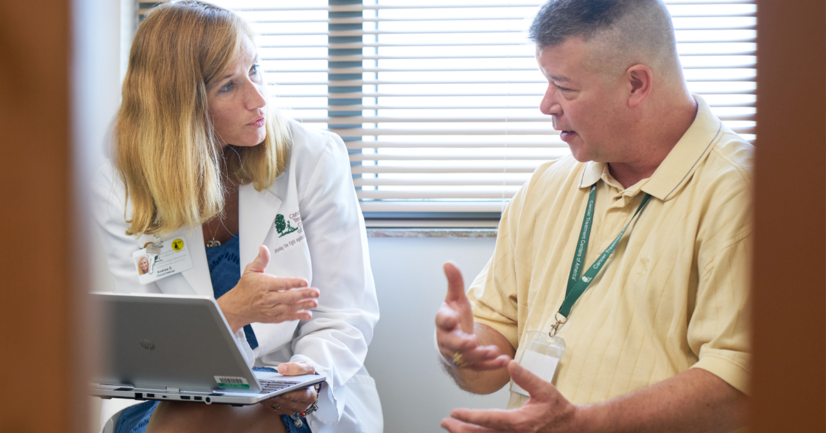 A female physician reviewing next steps with a colon cancer patient